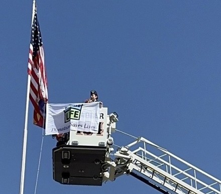 American flag and Donate Life banner raised