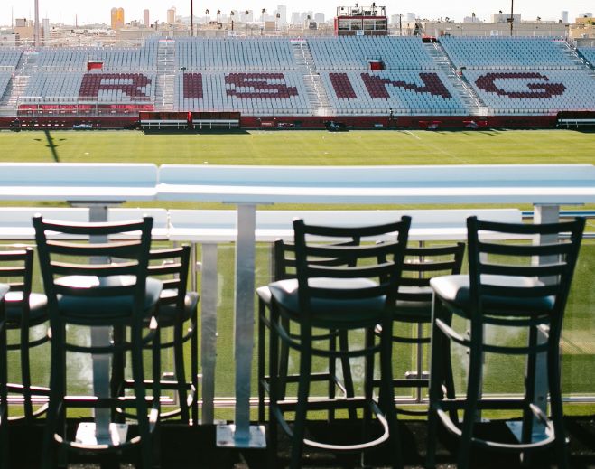 Empty stadium seating overlooking football field