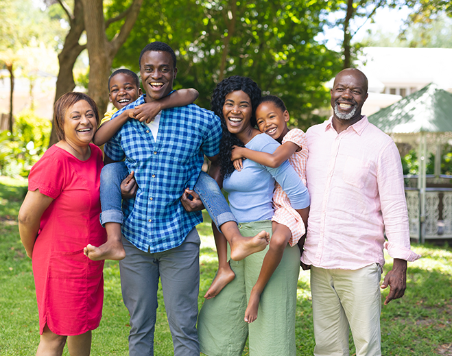 Family standing together outdoors smiling