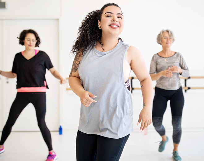 Group fitness class doing cardio exercise
