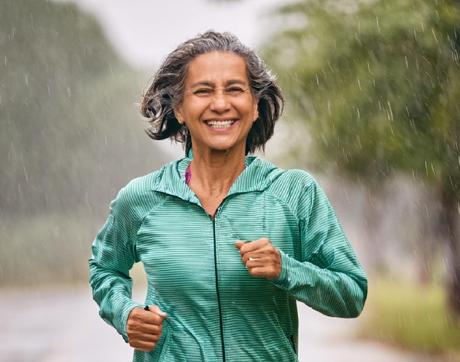 Person jogging outdoors in rain