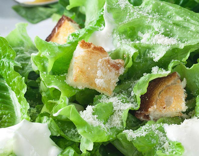 Caesar salad with croutons and dressing