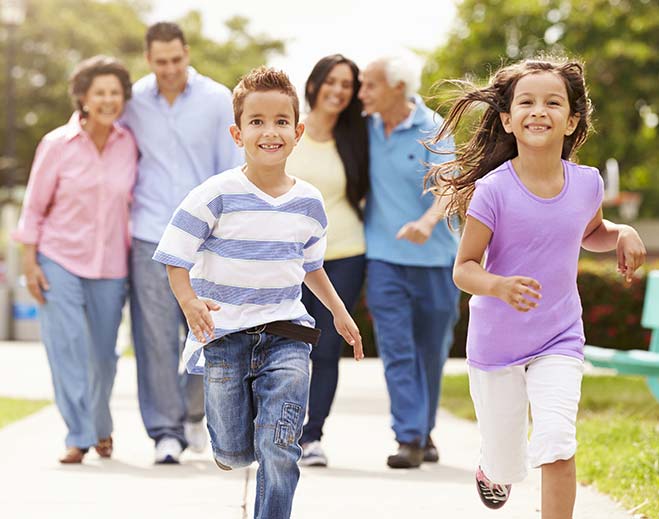 Children running with family in background