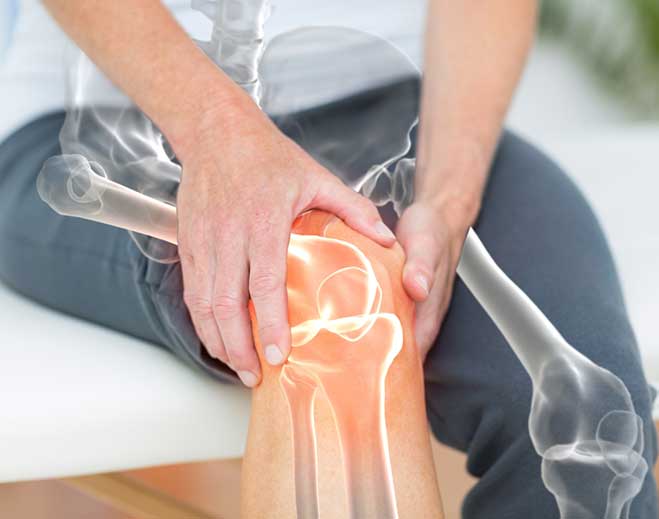 Hands holding knee with joint pain highlight