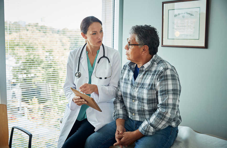 Clinician reviewing medical information with patient