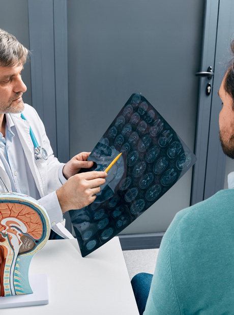 Doctor reviewing brain MRI with patient
