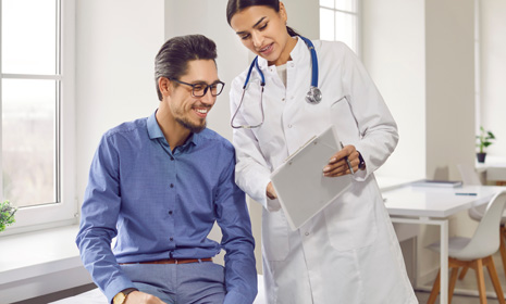 Doctor reviewing medical information with patient