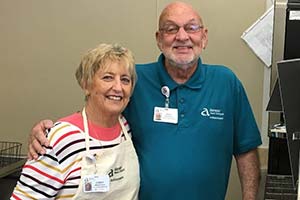 Don Miller with wife volunteering